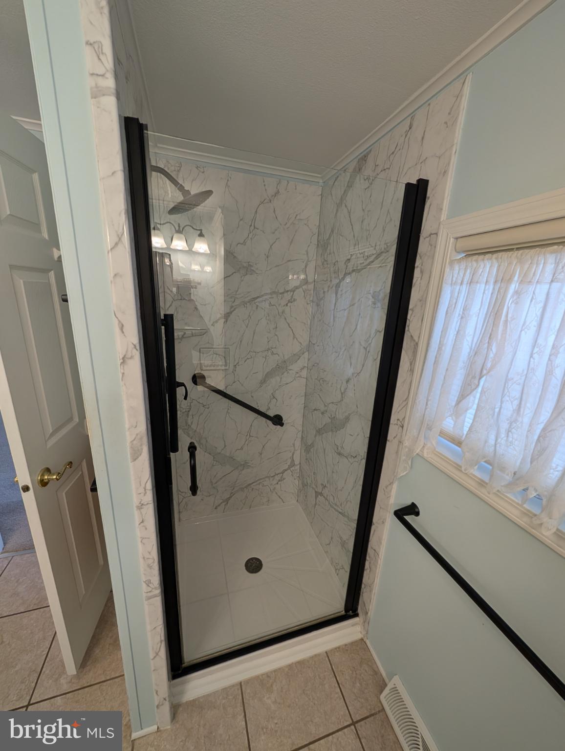 161 Grouse Circle New Hope, PA 18938 - Photo 10 of 16 a bathroom with a glass door shower and vanity