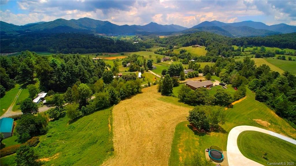 0 Jones Road Leicester, NC 28748 - Photo 14 of 15 a view of a lush green hillside and a houses