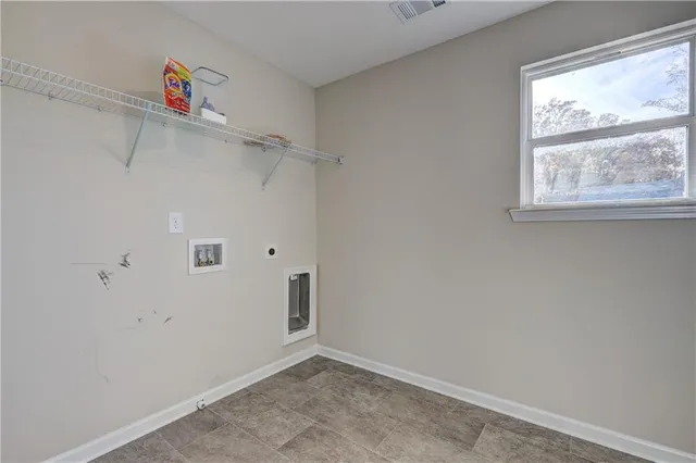 a bathroom with a shower and a sink