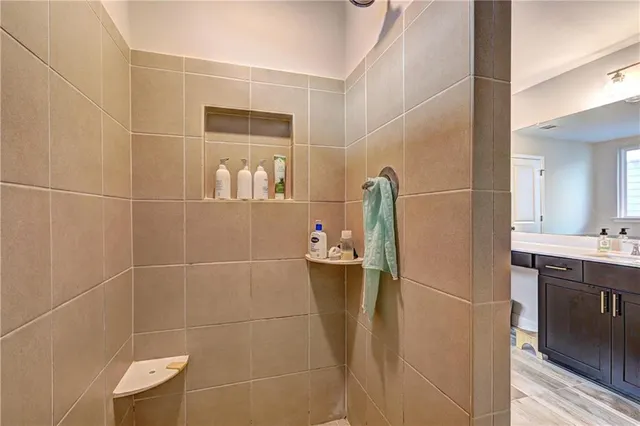 a bathroom with bathtub and window