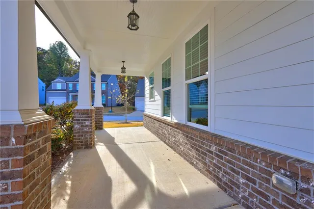 a view of a livingroom with furniture and a ceiling fan