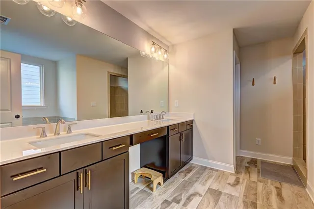 a view of an empty room with a ceiling fan