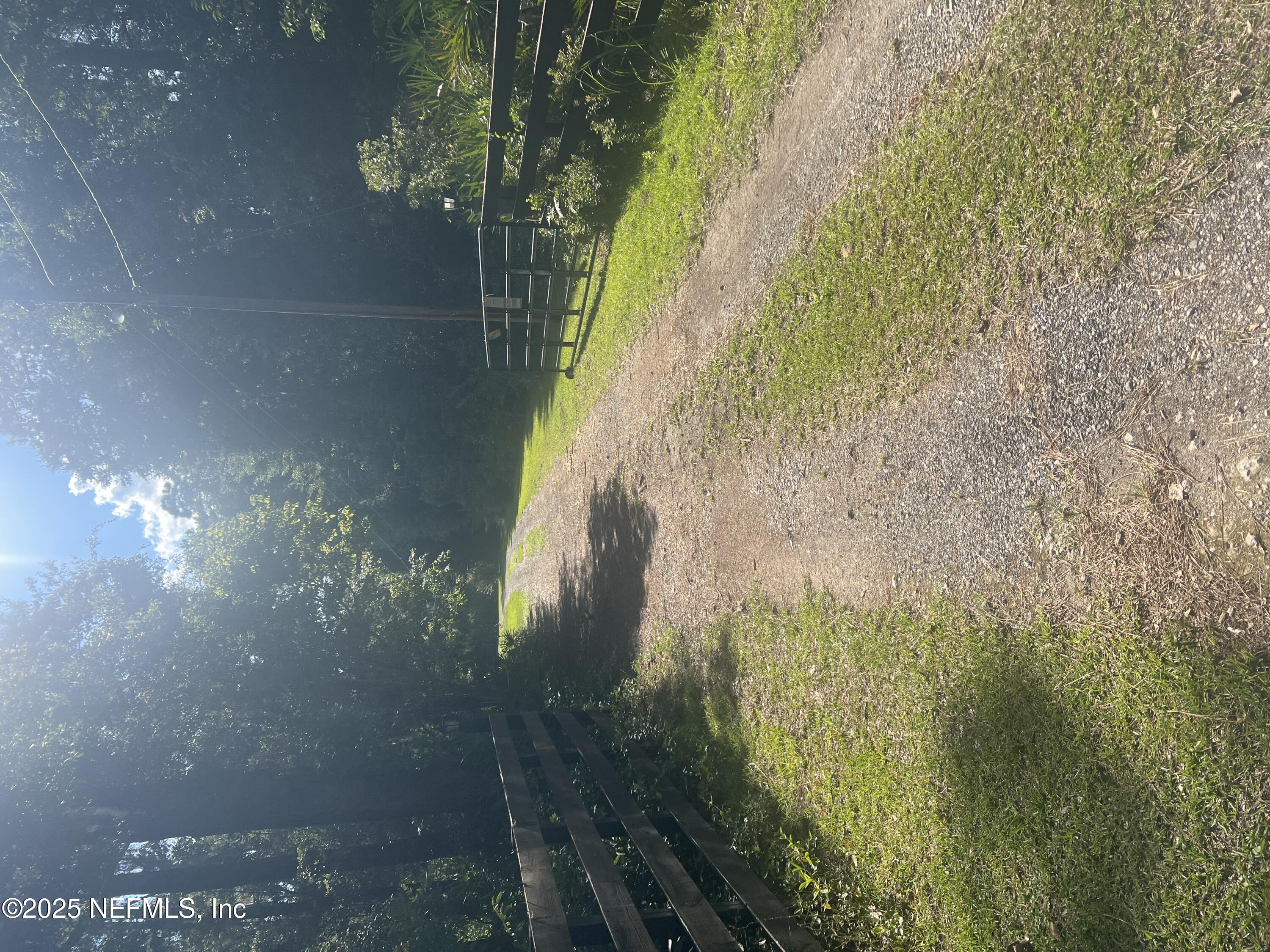 23720 Northwest 241st Road Northwest, Unit COUNTY High Springs, FL 32643 - Photo 4 of 12 Driveway going into property