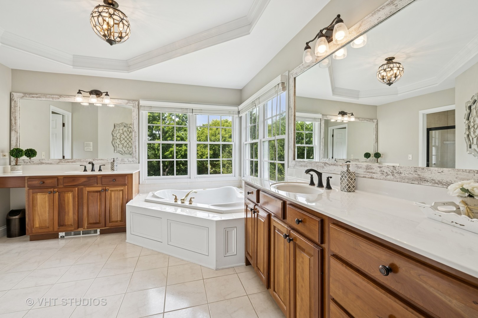 5609 Farmbrook Lane Crystal Lake, IL 60014 - Photo 15 of 35 a bathroom with a sink a vanity a mirror and a bathtub