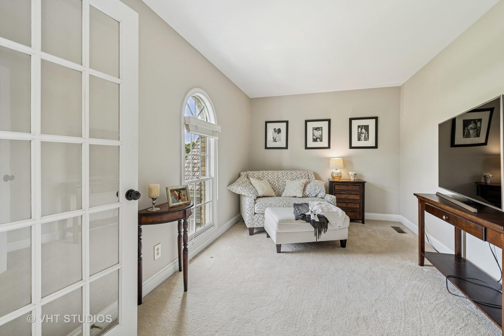 5609 Farmbrook Lane Crystal Lake, IL 60014 - Photo 17 of 35 a living room with furniture a flat screen tv and gym equipment