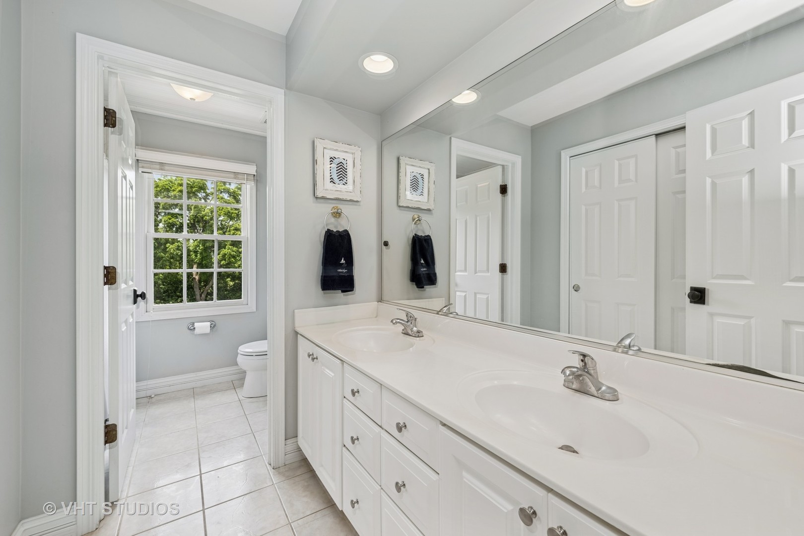5609 Farmbrook Lane Crystal Lake, IL 60014 - Photo 19 of 35 a spacious bathroom with a shower sink and mirror