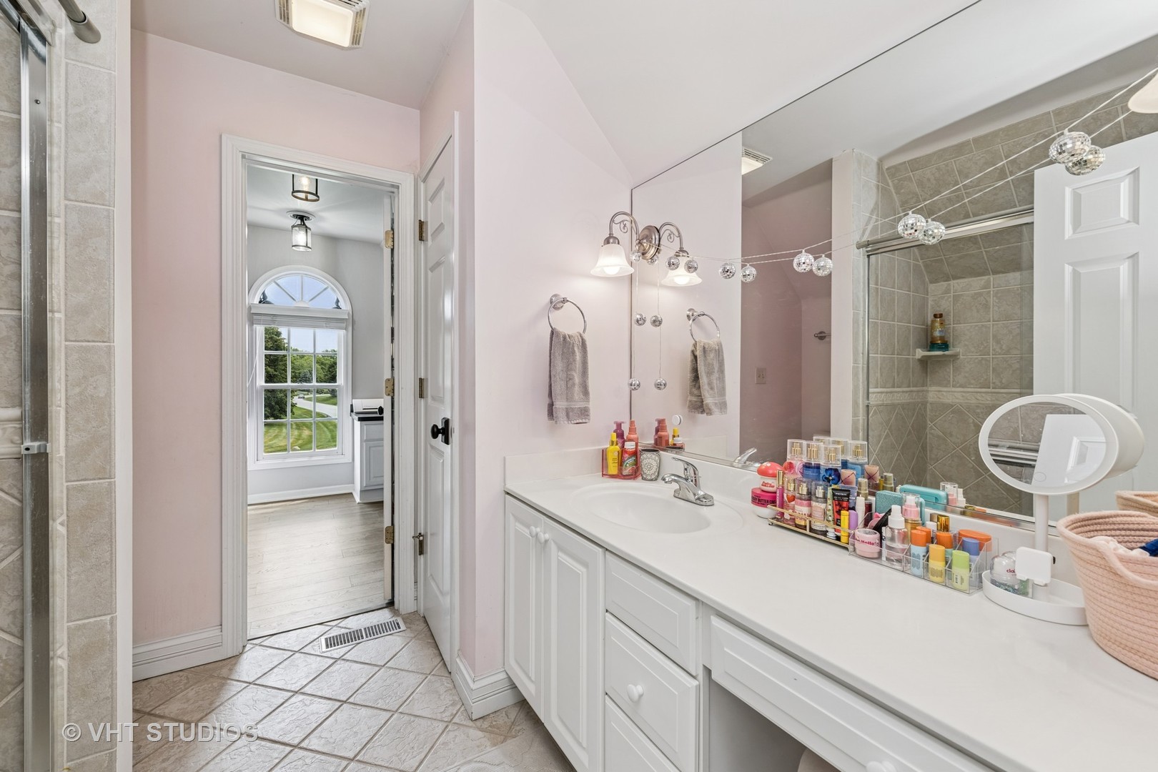 5609 Farmbrook Lane Crystal Lake, IL 60014 - Photo 22 of 35 a bathroom with a sink mirror and shower