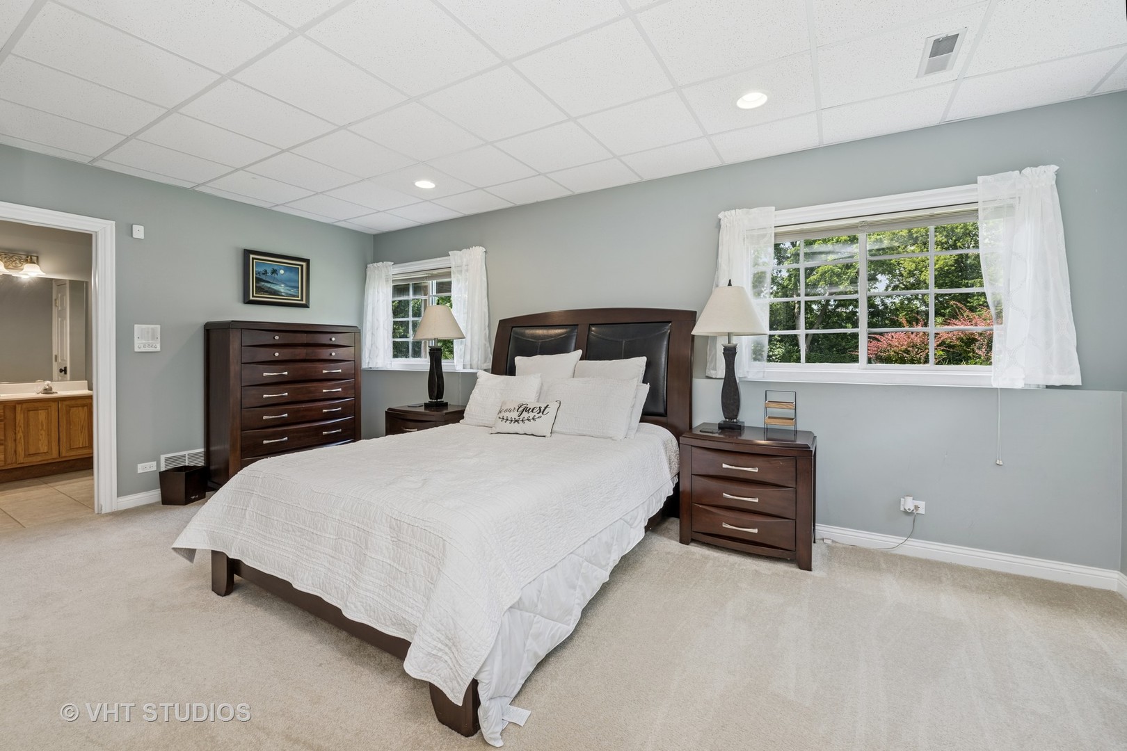 5609 Farmbrook Lane Crystal Lake, IL 60014 - Photo 24 of 35 a spacious bedroom with a bed and a dresser