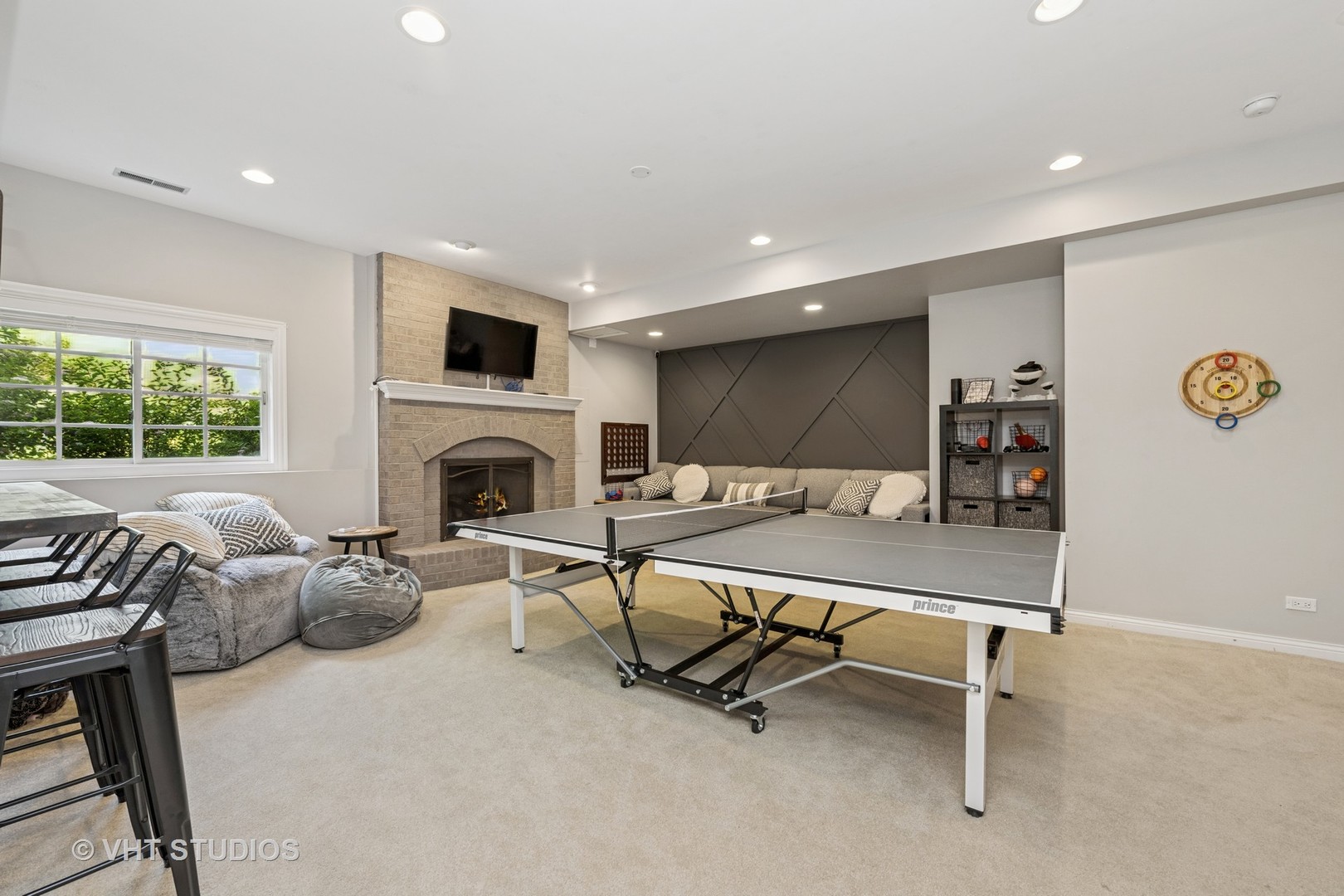 5609 Farmbrook Lane Crystal Lake, IL 60014 - Photo 26 of 35 a living room with furniture a fireplace and a flat screen tv