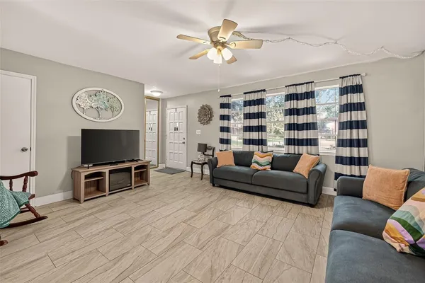 a living room with furniture and a flat screen tv