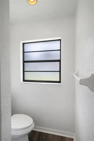 a bathroom with a toilet and a sink