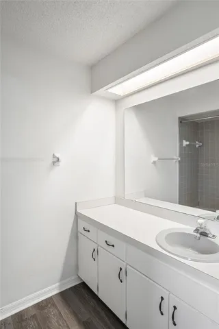a white toilet sitting next to a bathroom sink