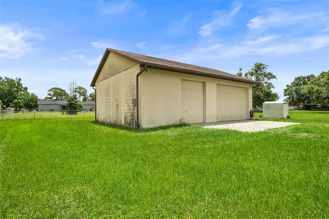 a backyard of a house with lots of green space