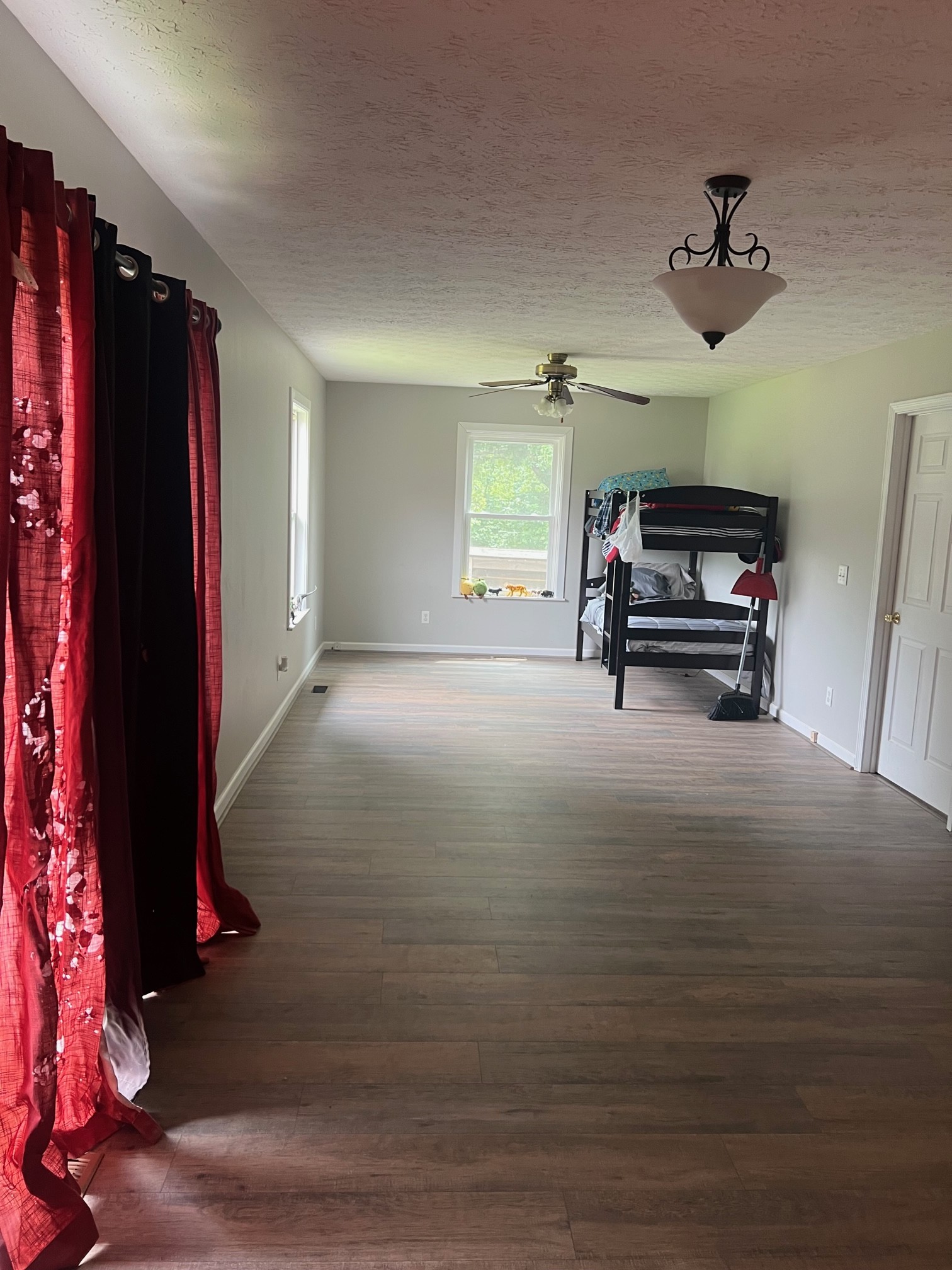 545 Austin Bottom Road Baxter, TN 38544 - Photo 15 of 24 a view of empty room with wooden floor and fan