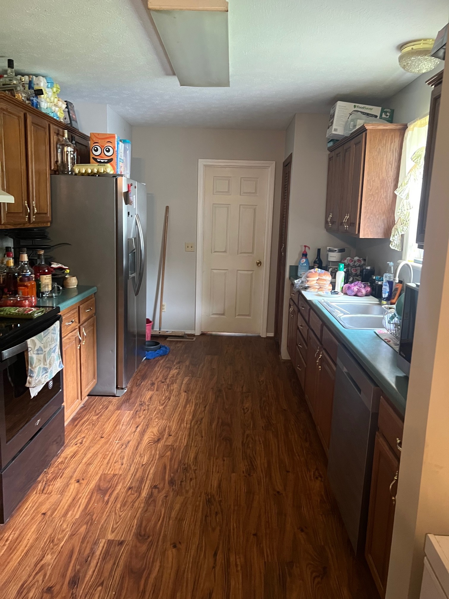545 Austin Bottom Road Baxter, TN 38544 - Photo 16 of 24 a kitchen with refrigerator and window