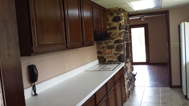 631 East Park Road Oregon, IL 61061 - Photo 12 of 17 a kitchen with a sink and a refrigerator