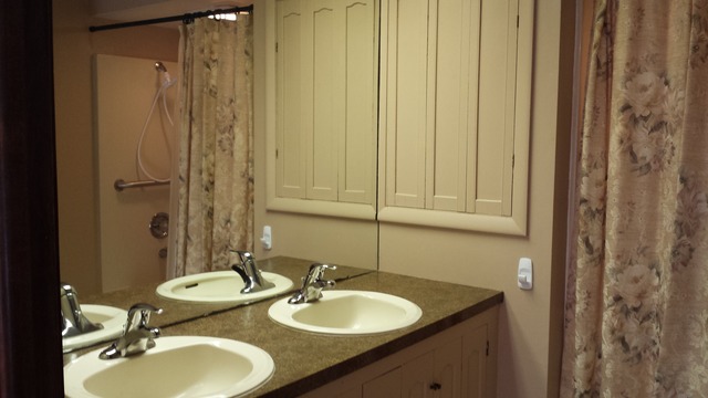 631 East Park Road Oregon, IL 61061 - Photo 6 of 17 a bathroom with a granite countertop sink and a mirror