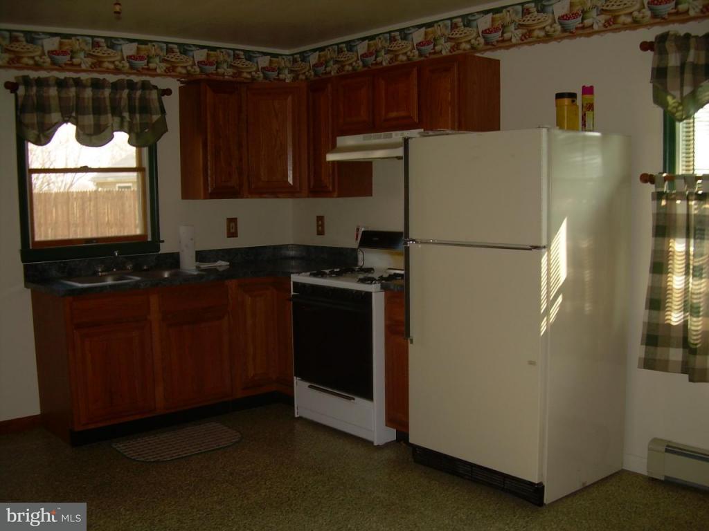 147 Chestnut Street Lititz, PA 17543 - Photo 13 of 13 a white refrigerator freezer sitting in a kitchen
