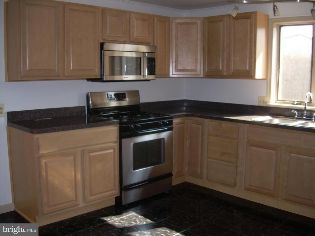 147 Chestnut Street Lititz, PA 17543 - Photo 6 of 13 a kitchen with sink cabinets and microwave