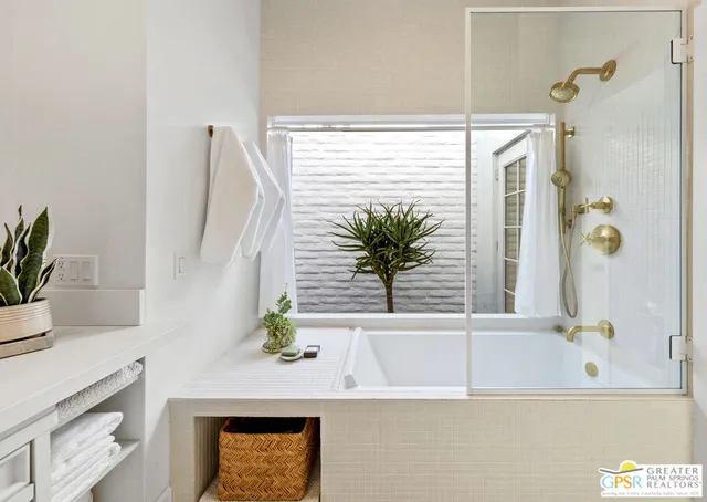 a bathroom with a bathtub and a sink