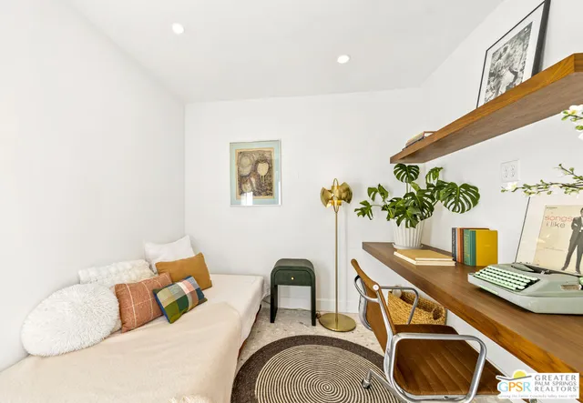 a living room with furniture and a table