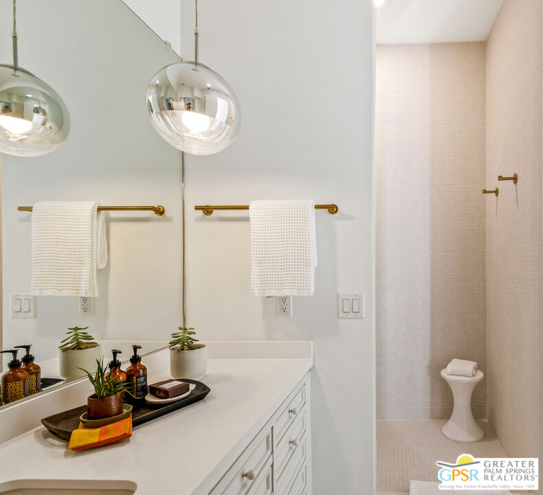 47420 Rabat Drive Palm Desert, CA 92260 - Photo 14 of 27 a bathroom with a sink and a mirror with toilet