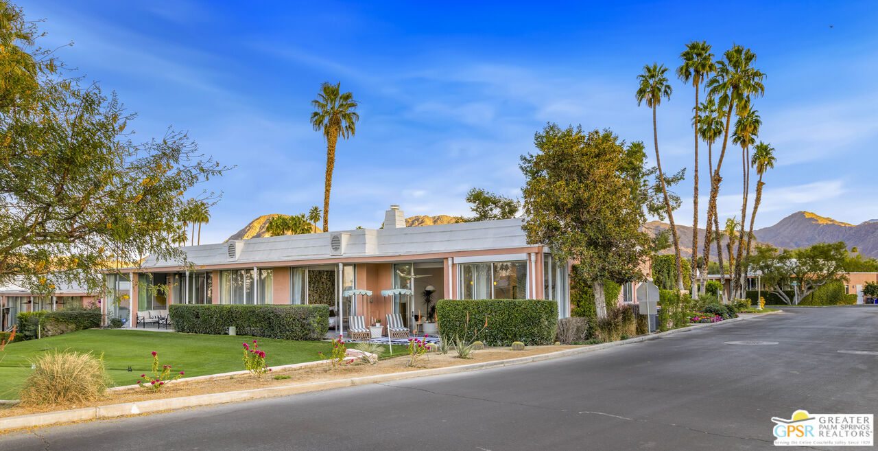 47420 Rabat Drive Palm Desert, CA 92260 - Photo 17 of 27 a front view of a house with a yard and outdoor seating
