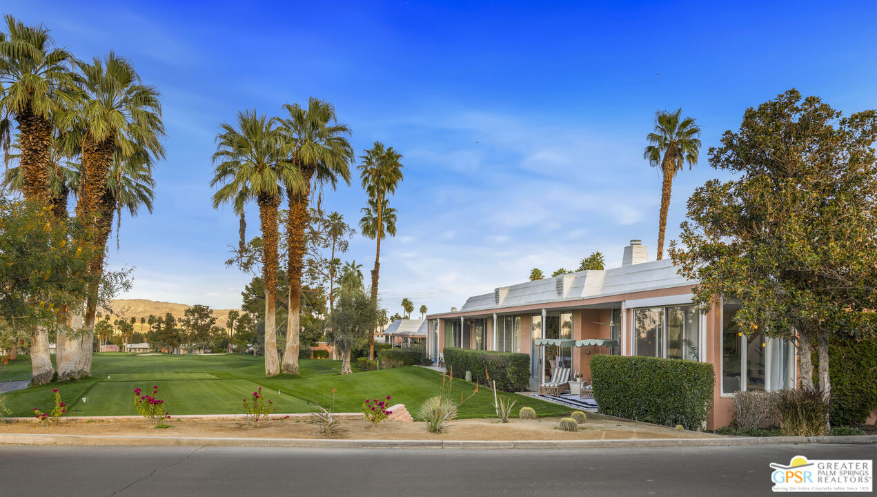 47420 Rabat Drive Palm Desert, CA 92260 - Photo 18 of 27 a view of a house with a yard and a palm tree