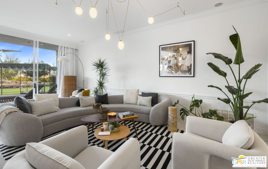 47420 Rabat Drive Palm Desert, CA 92260 - Photo 21 of 27 a living room with furniture ceiling fan and a large window