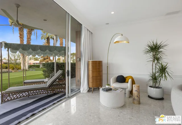 a view of a living room and a potted plant