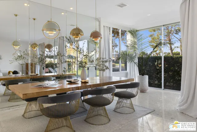 a very nice looking living room with a large window and furniture