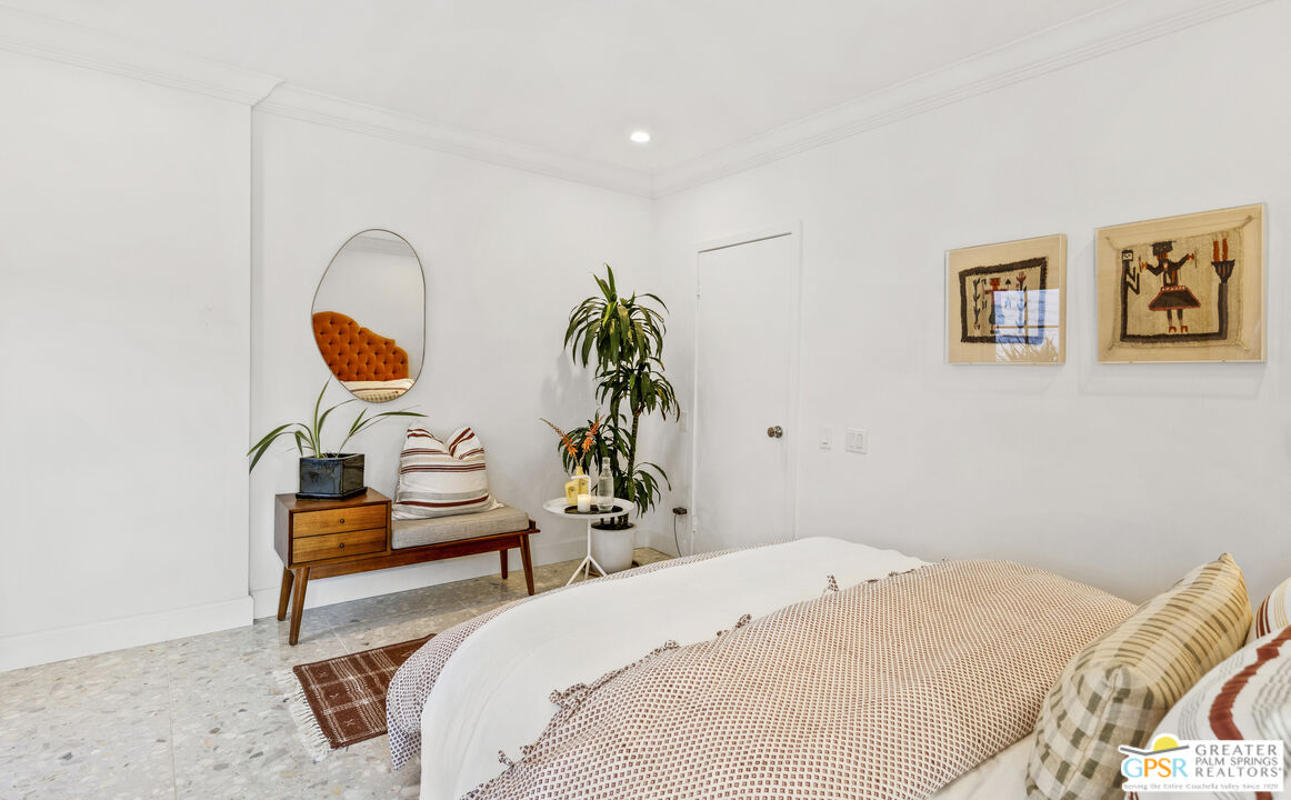 47420 Rabat Drive Palm Desert, CA 92260 - Photo 8 of 27 a bedroom with bed and a painting on the wall