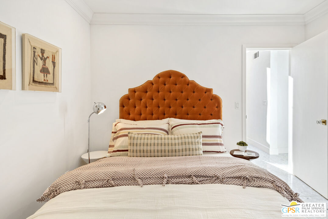 47420 Rabat Drive Palm Desert, CA 92260 - Photo 9 of 27 a bedroom with a bed and a painting on the wall