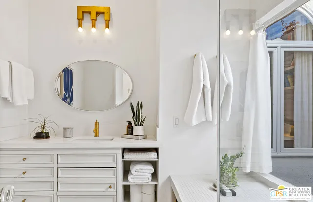 a bathroom with a sink and a mirror