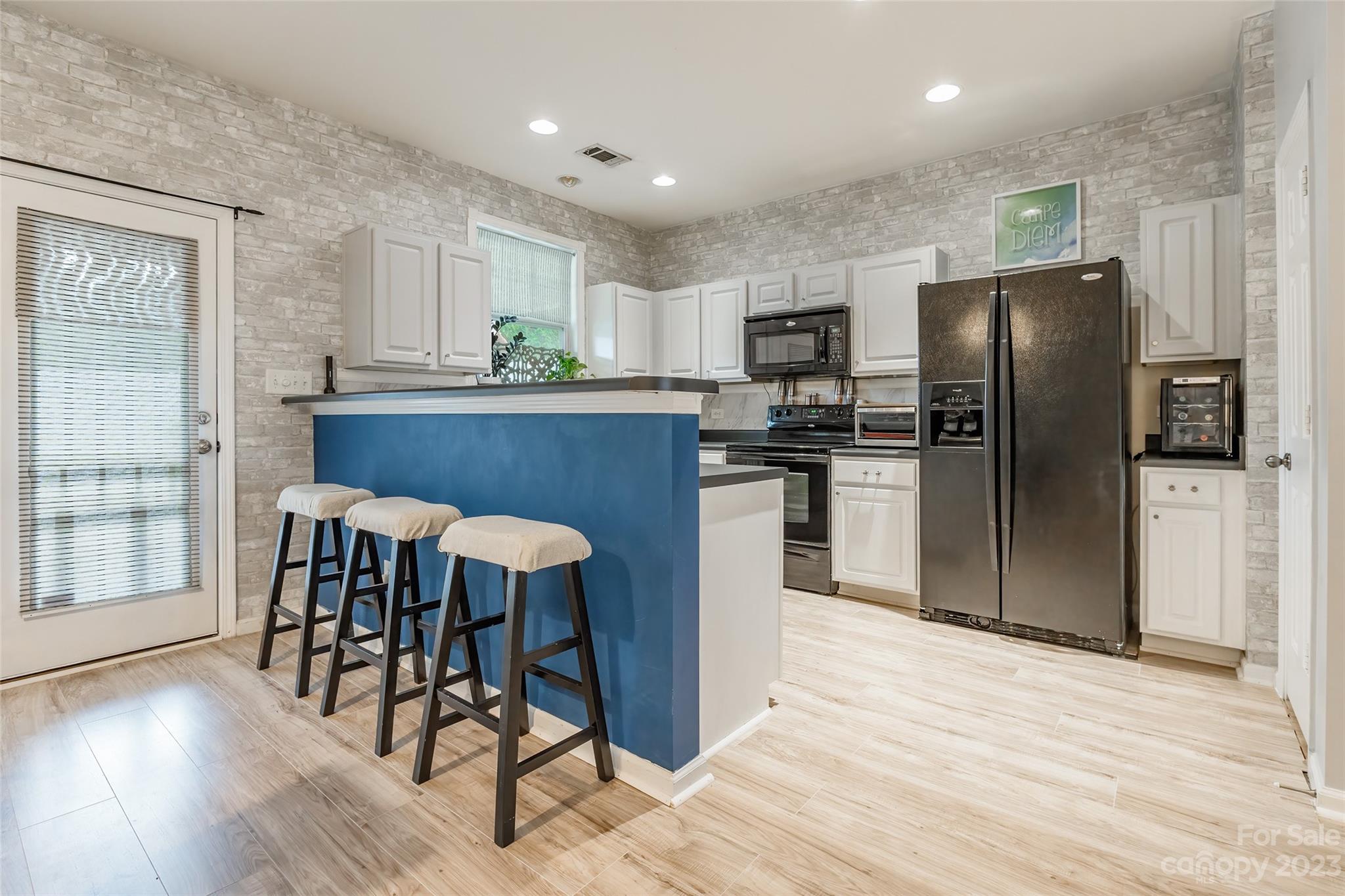 617 Potter Place Road Fort Mill, SC 29708 - Photo 8 of 26 a kitchen with stainless steel appliances granite countertop a refrigerator a stove and a wooden cabinets