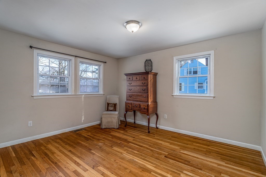 8 Brown Road Shirley, MA 01464 - Photo 28 of 42 a view of an empty room with a window and wooden floor