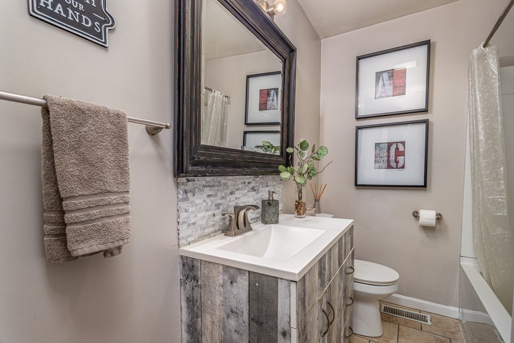 8 Brown Road Shirley, MA 01464 - Photo 32 of 42 a bathroom with a sink and a mirror