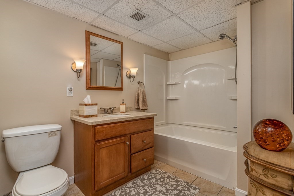 8 Brown Road Shirley, MA 01464 - Photo 36 of 42 a bathroom with a granite countertop toilet sink and mirror