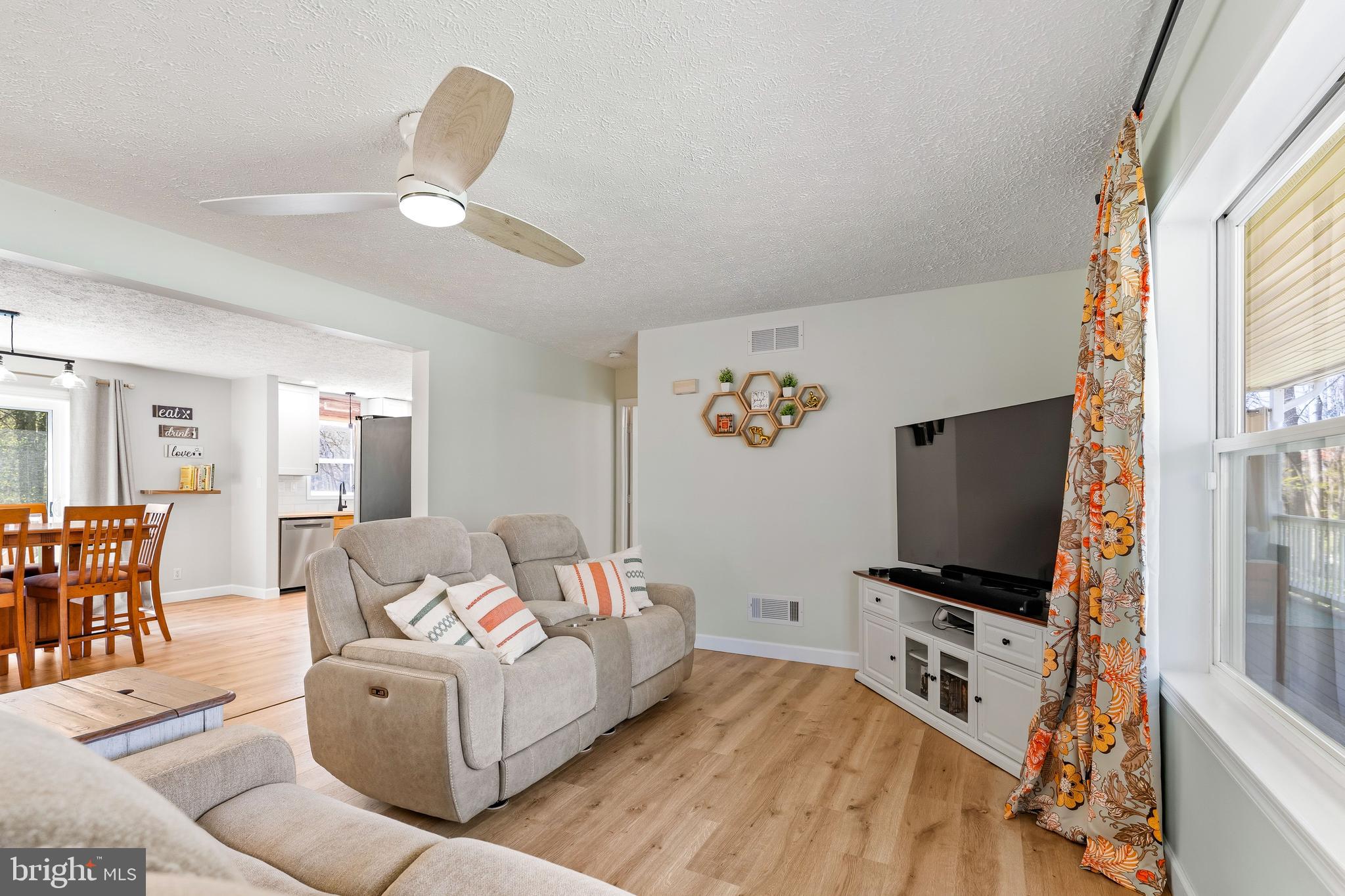 458 Tonys Road Elkton, MD 21921 - Photo 12 of 27 a living room with furniture and a flat screen tv