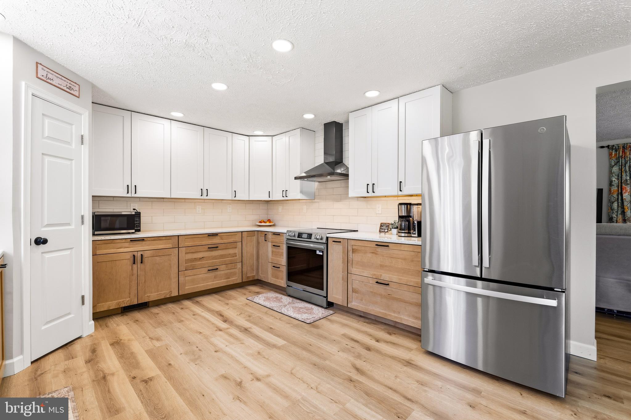 458 Tonys Road Elkton, MD 21921 - Photo 14 of 27 a kitchen with granite countertop stainless steel appliances and wooden cabinets