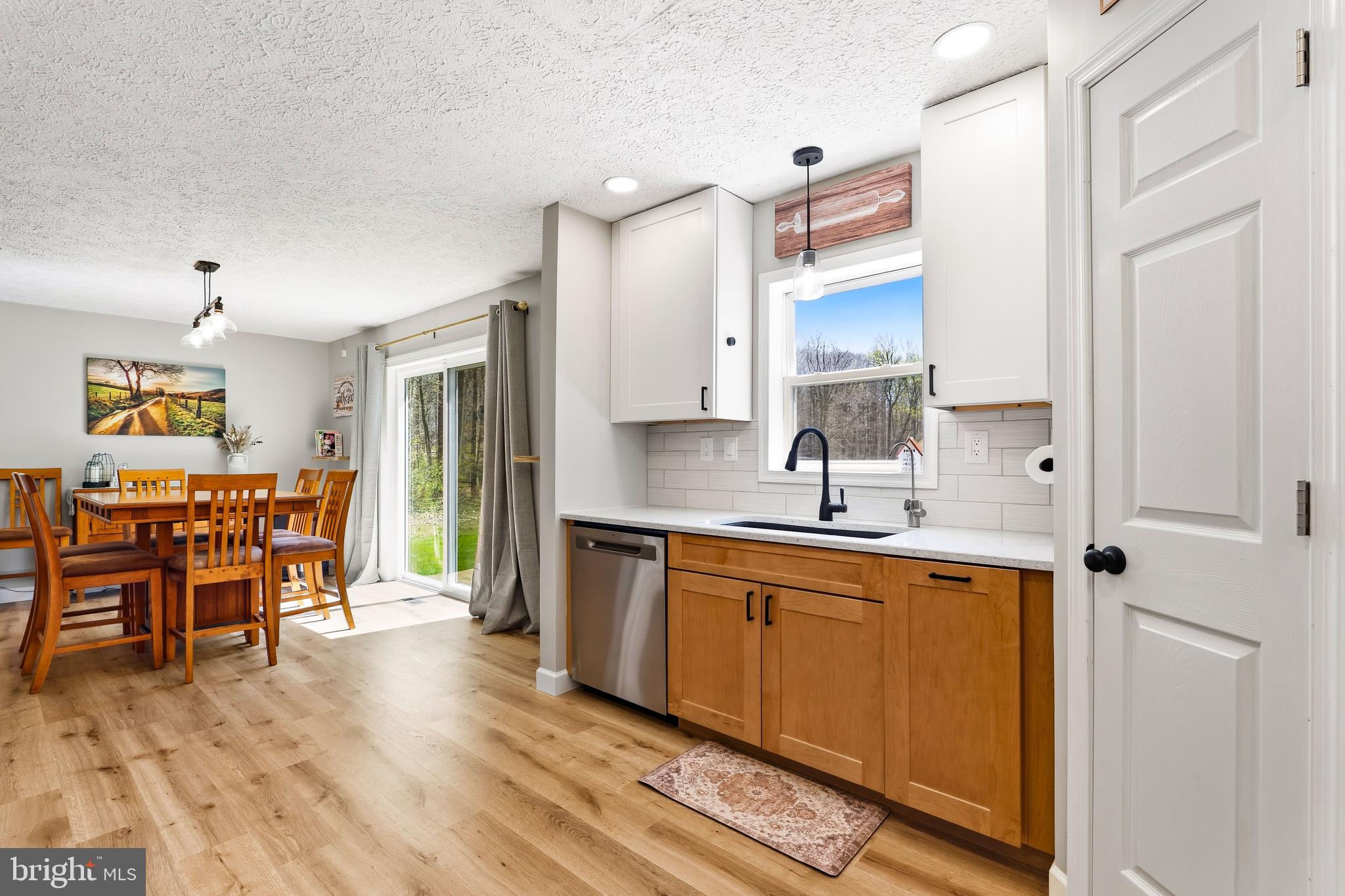 458 Tonys Road Elkton, MD 21921 - Photo 15 of 27 a kitchen with stainless steel appliances a sink cabinets and wooden floor