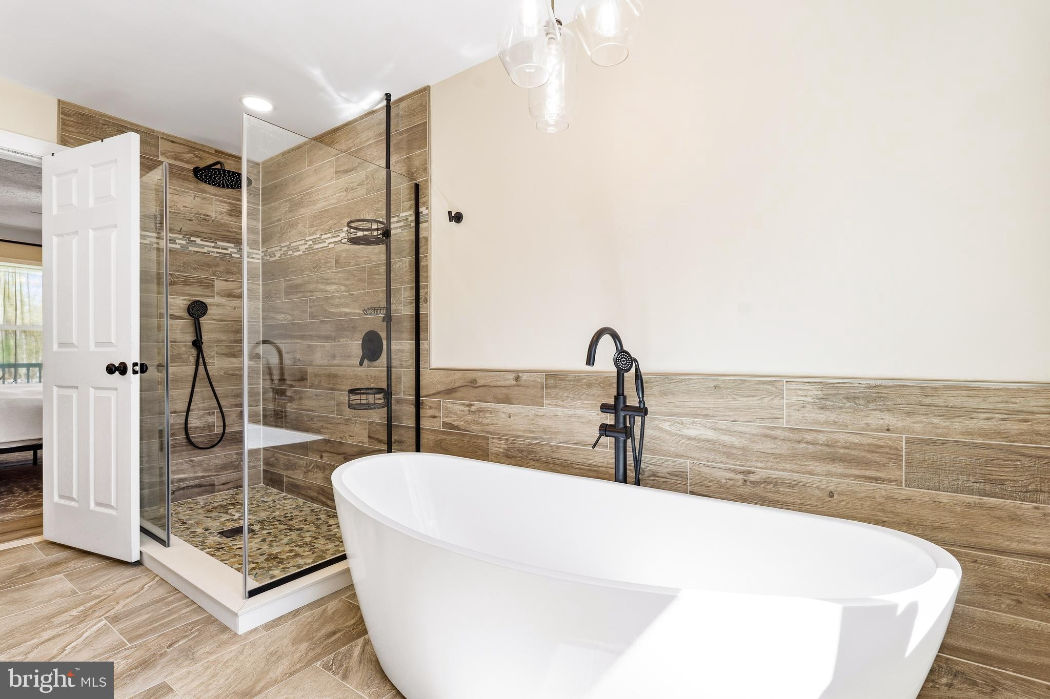 458 Tonys Road Elkton, MD 21921 - Photo 25 of 27 a bathroom with a bathtub and a shower