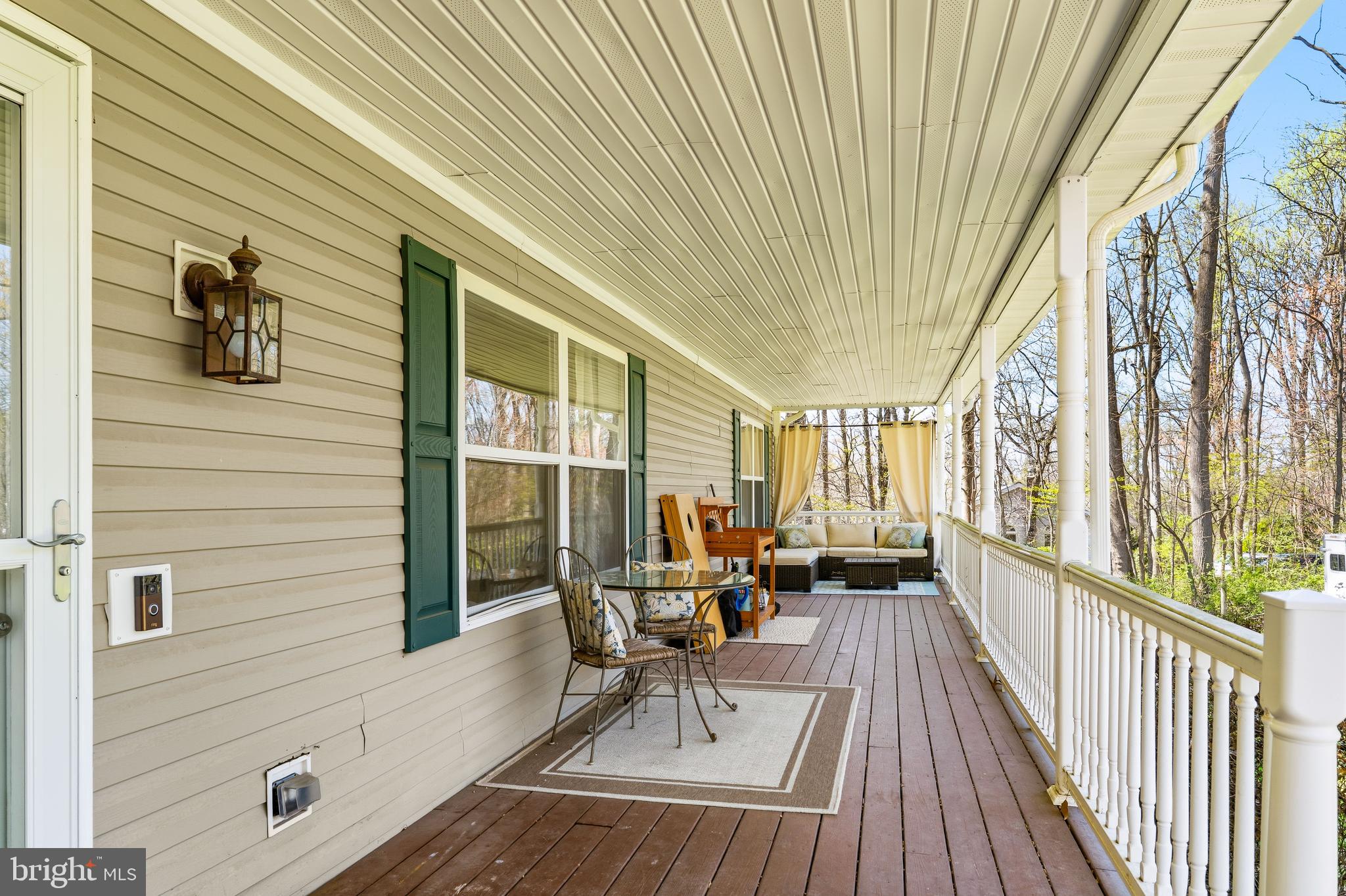 458 Tonys Road Elkton, MD 21921 - Photo 5 of 27 a balcony with chairs and wooden floor
