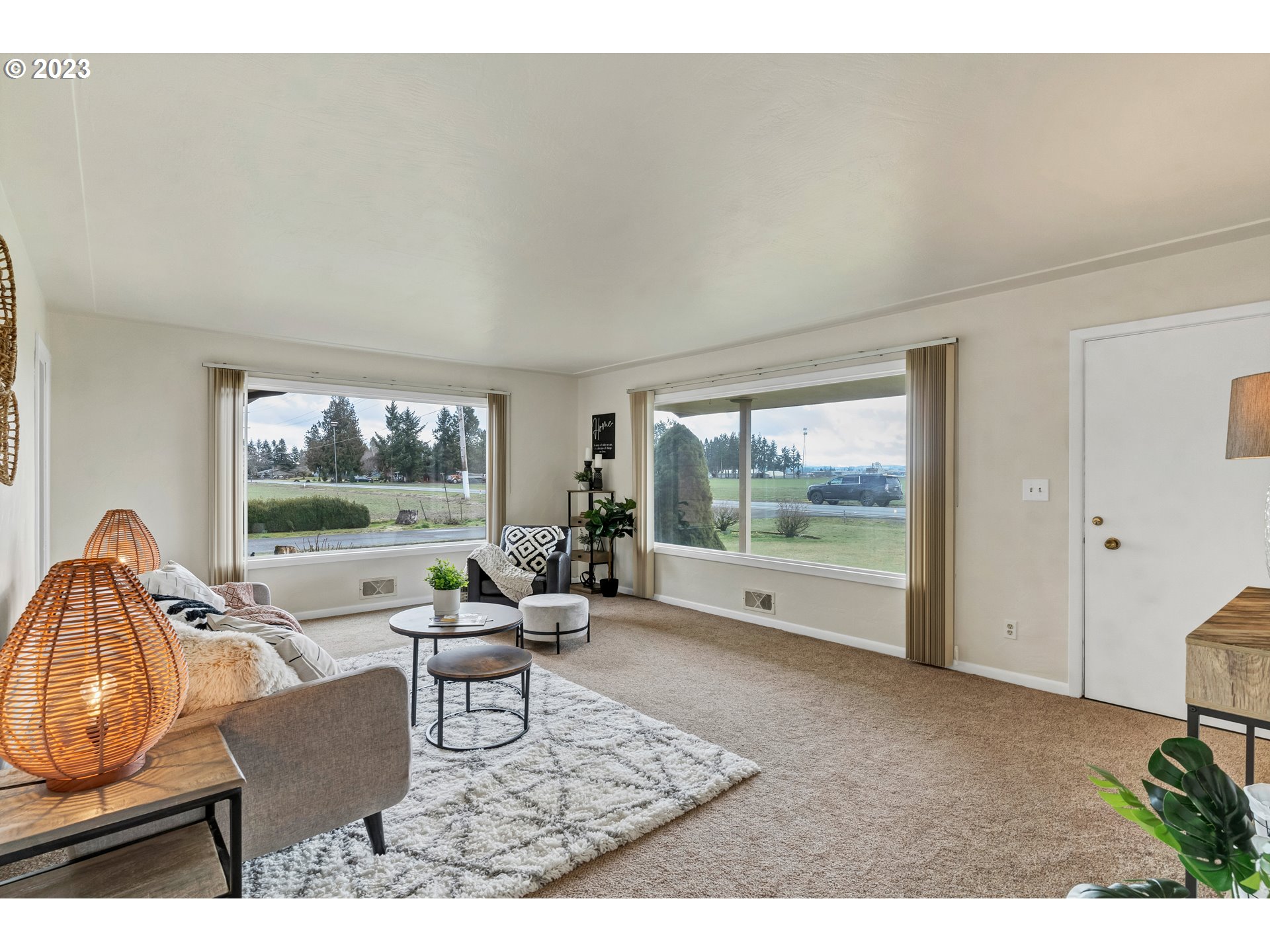 11481 Shaff Road Southeast Aumsville, OR 97325 - Photo 3 of 32 a living room with furniture and a floor to ceiling window
