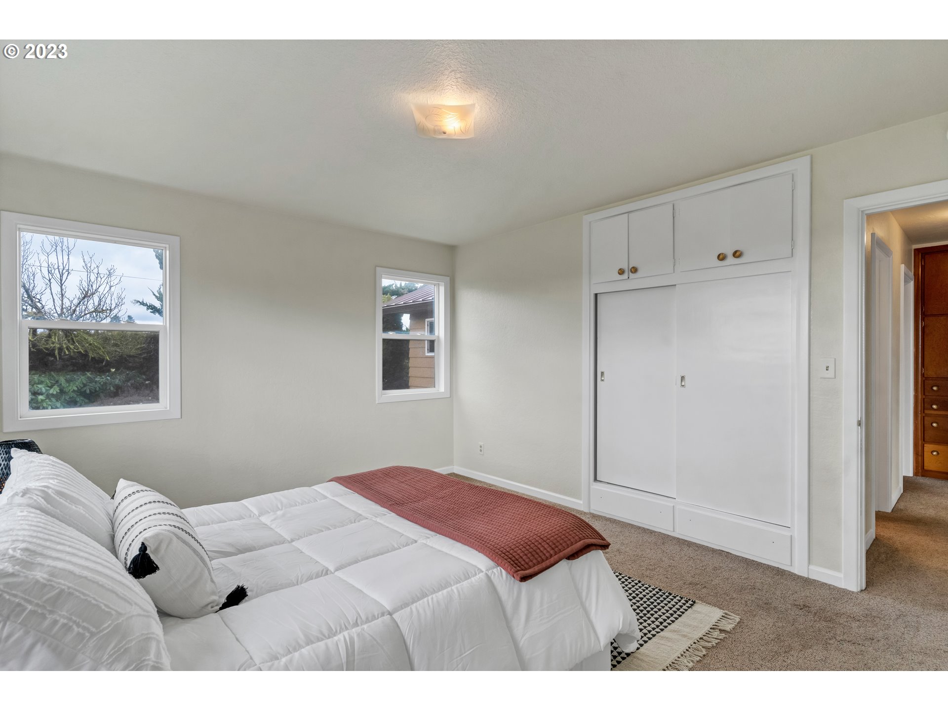 11481 Shaff Road Southeast Aumsville, OR 97325 - Photo 7 of 32 a bedroom with a bed and a window
