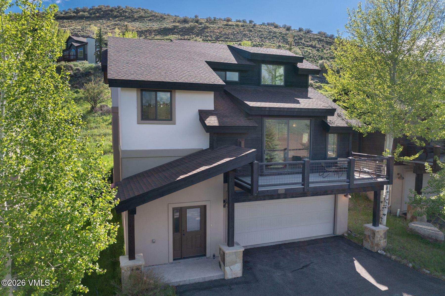 1015 West Wildwood Road, Unit F Avon, CO 81620 - Photo 30 of 35 a view of a house with a balcony