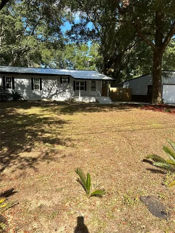 a front view of a house with swimming pool