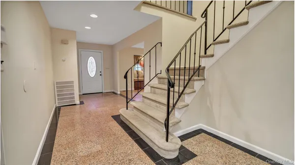 a view of entryway with wooden floor