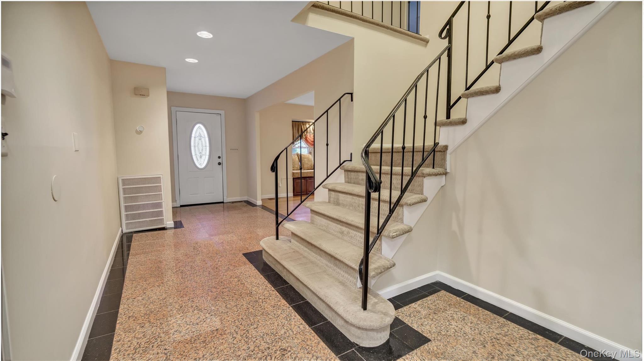 47 Carriage Road Roslyn, NY 11576 - Photo 15 of 31 Foyer with visible vents, baseboards, stairway, and granite finish floor