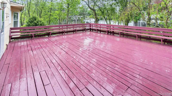 a view of backyard with swimming pool and outdoor seating